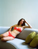 Stylized model image of red cotton bra and panty