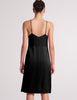 black silk slip back view on woman 