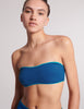 On model, 3/4 image of blue bandeau top