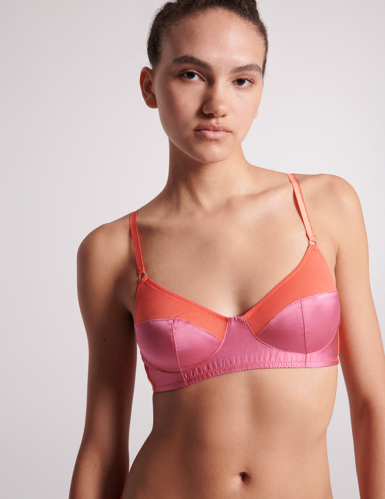 On model image of orange cotton with pink silk bralette