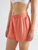 Side view of pink pajama shorts