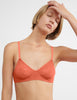 On model image of orange bralette