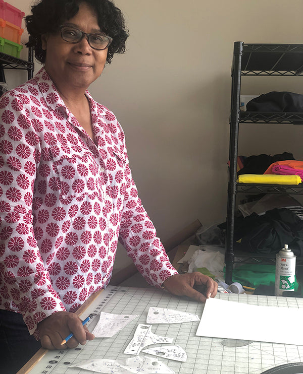 Woman in at sewing work table